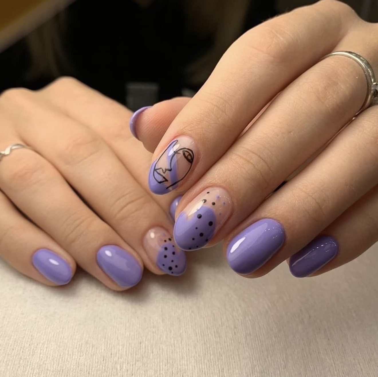 Lilac nail art manicure with hand-painted details at Hideaway Nail Design